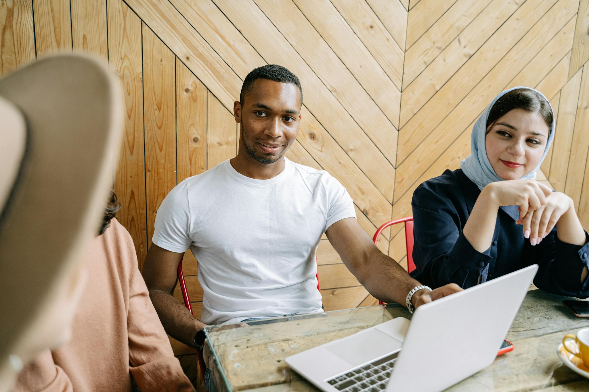 Group of professionals collaborating on a project in a modern workplace setting.